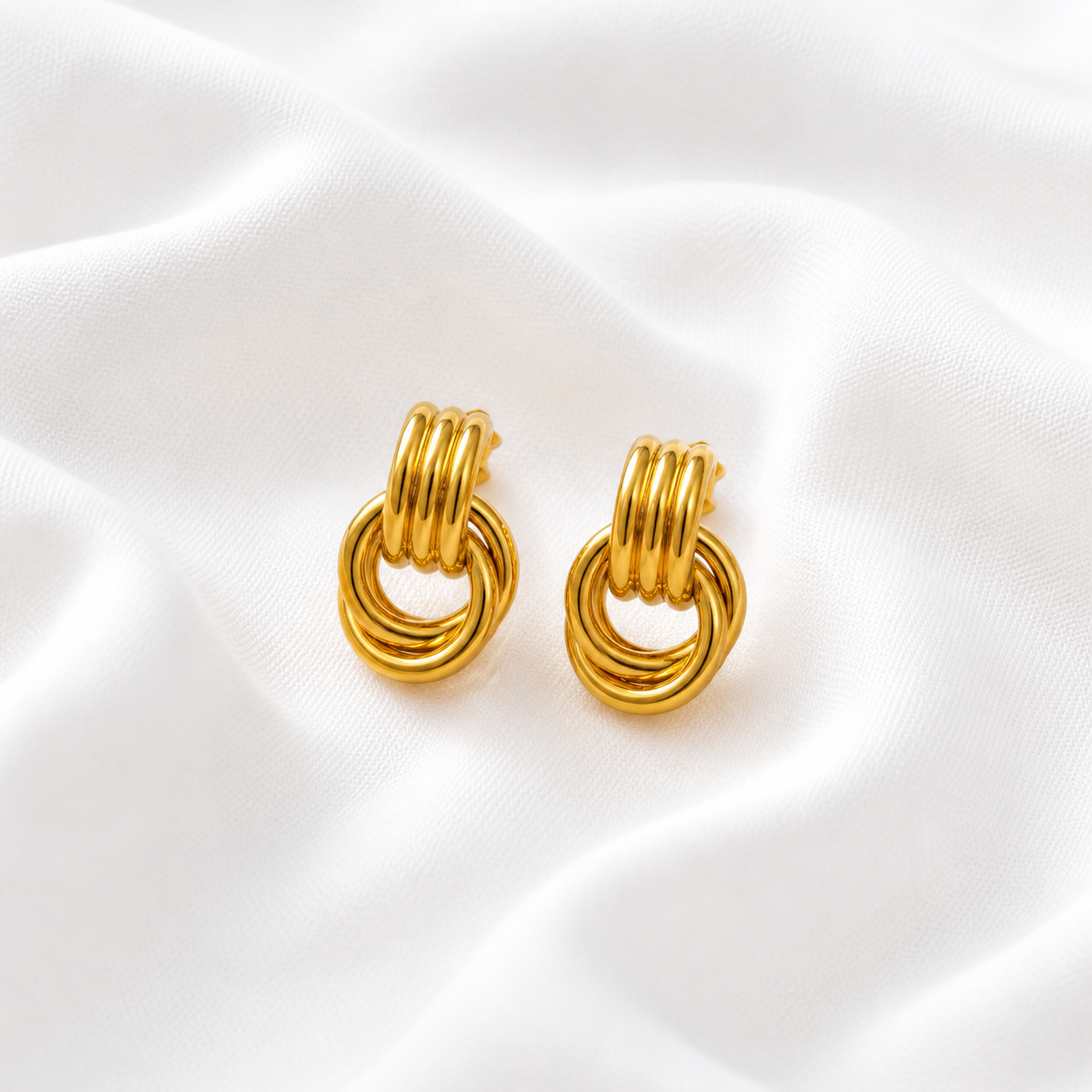 BRINCO AROS TRIPLOS PEQUENO INOX DOURADO