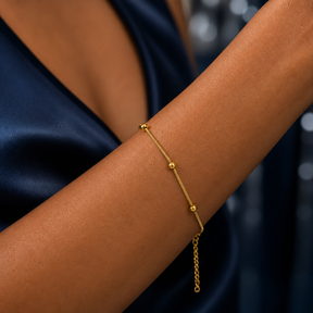 PULSEIRA FINA BOLINHAS ESPAÇADAS INOX DOURADO