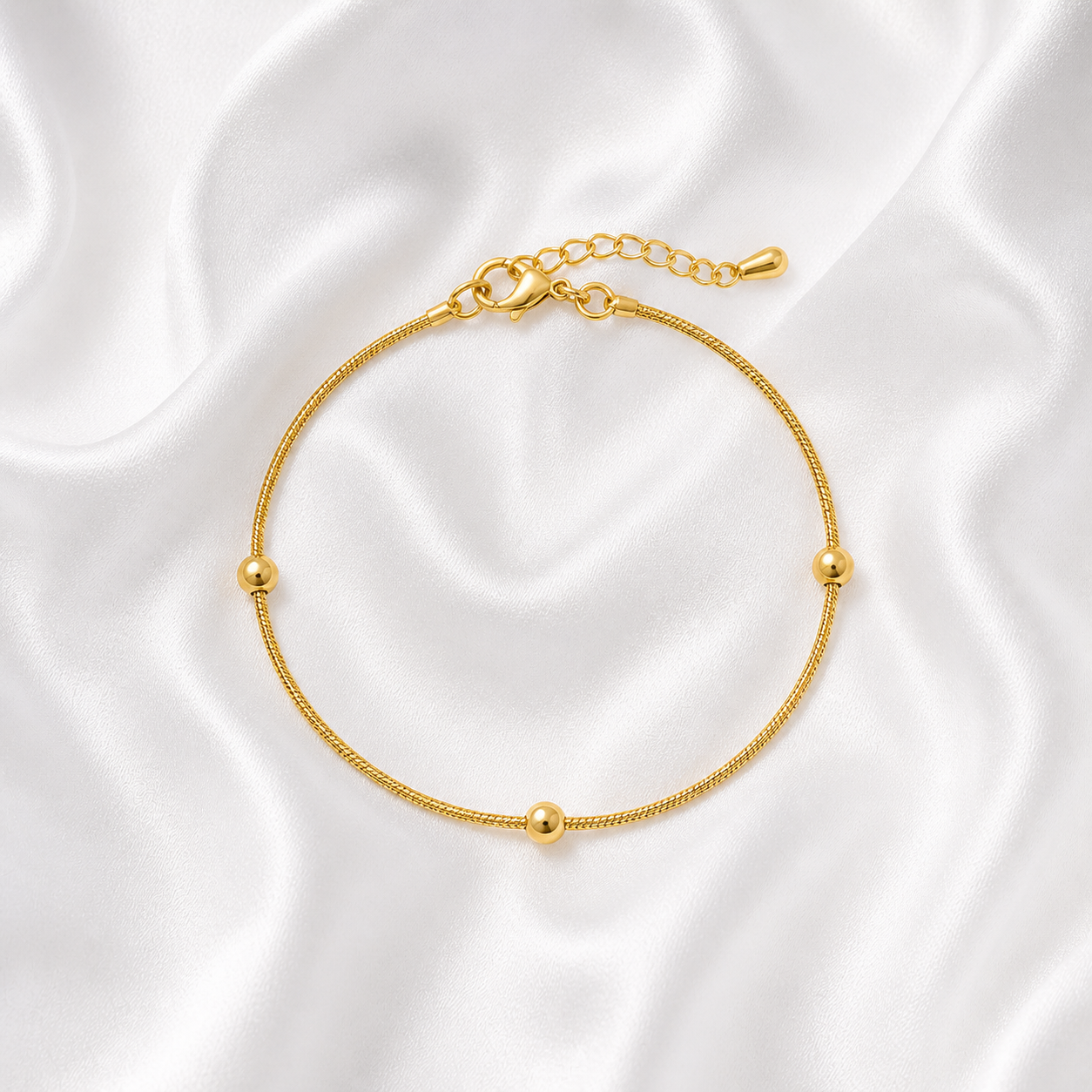 PULSEIRA FINA BOLINHAS ESPAÇADAS INOX DOURADO