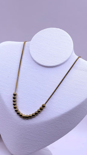 COLAR INOX GOLD BOLAS MEIO