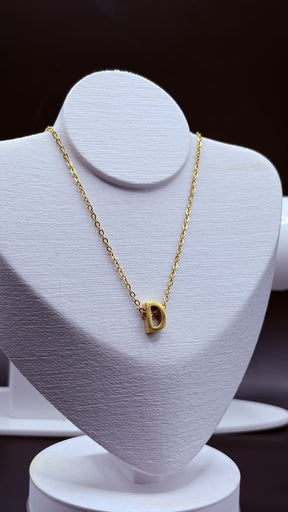 COLAR LETRA INOX DOURADO